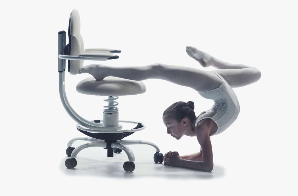 A girl working out on a white office chair
